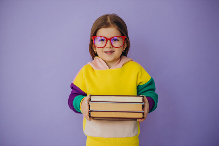 Cute Little Girl Holding Books